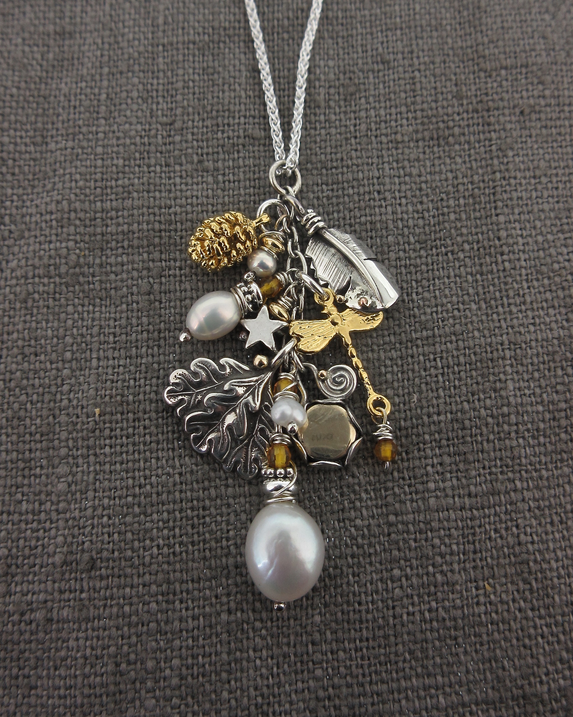 A Sterling silver multi-charm necklace. Total weight 9g.… | Drouot.com